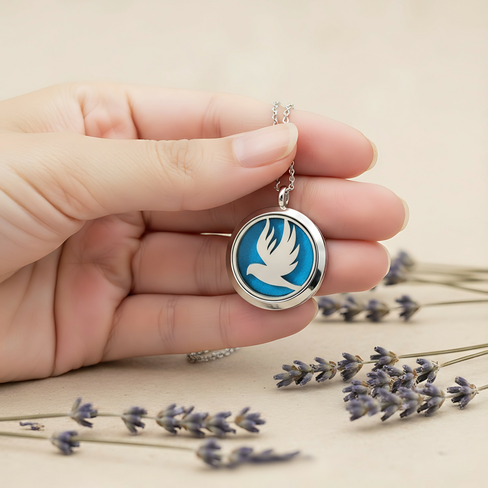 Dove necklace held in hand with lavender