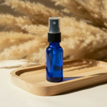 Spray bottle on wooden tray